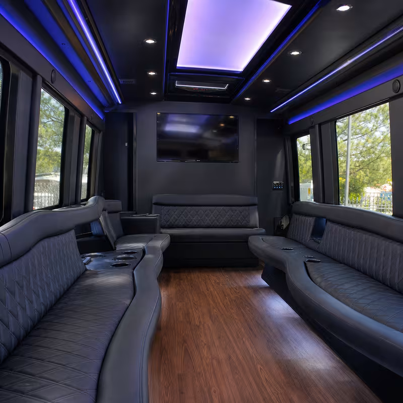 Friends laughing during a Lancaster party bus celebration