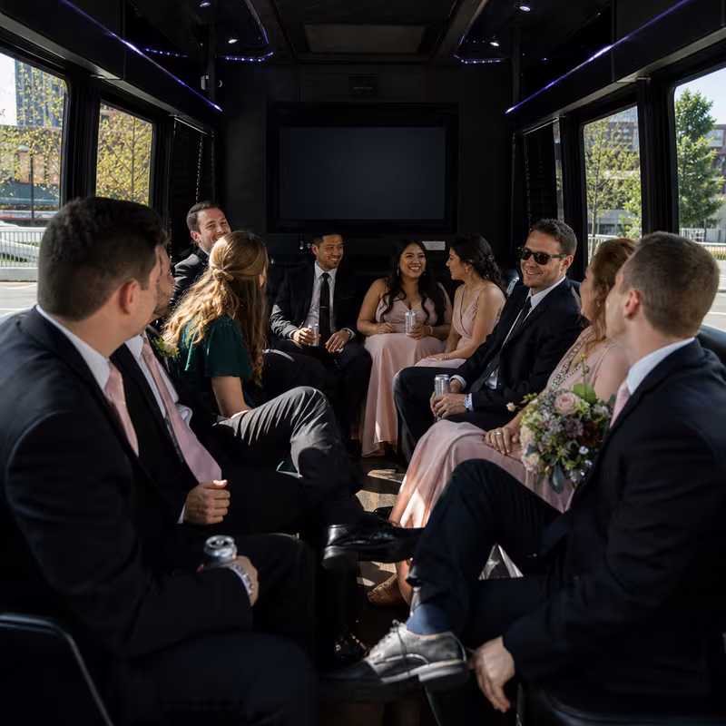 Wedding guests seated inside a Lancaster party bus