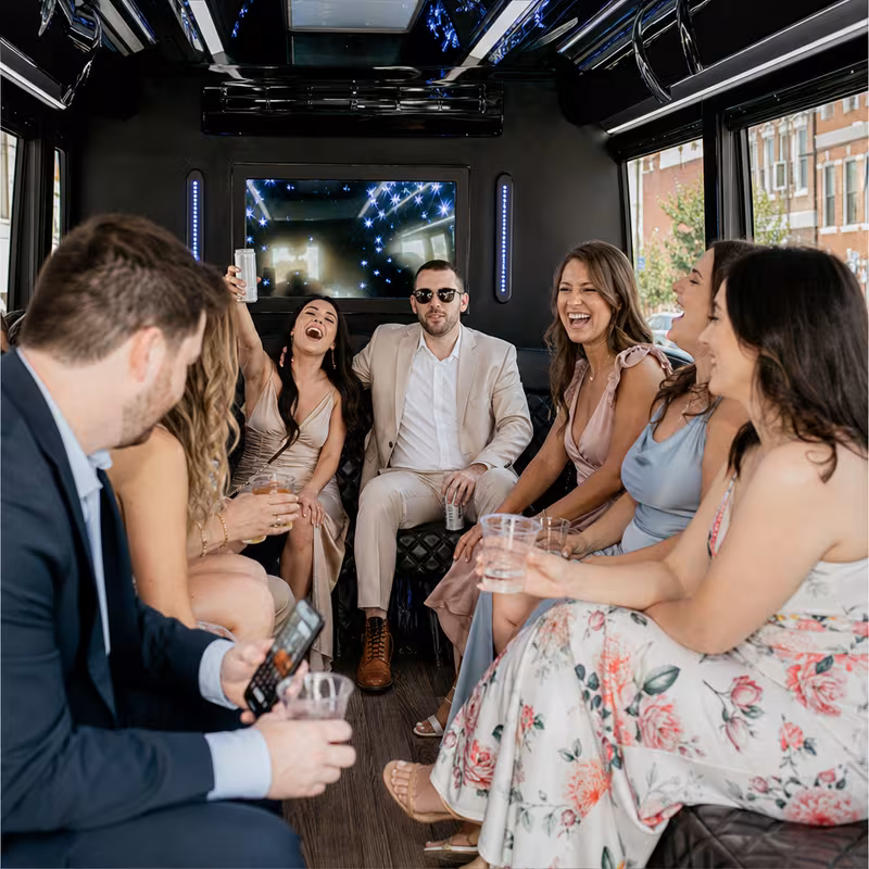 Party bus interior with wraparound leather seating and LED lighting in Lancaster