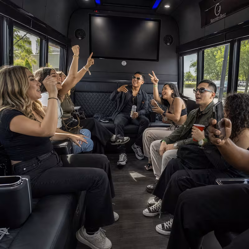 Group boarding a white charter bus for Concert Transportation transportation in Lancaster