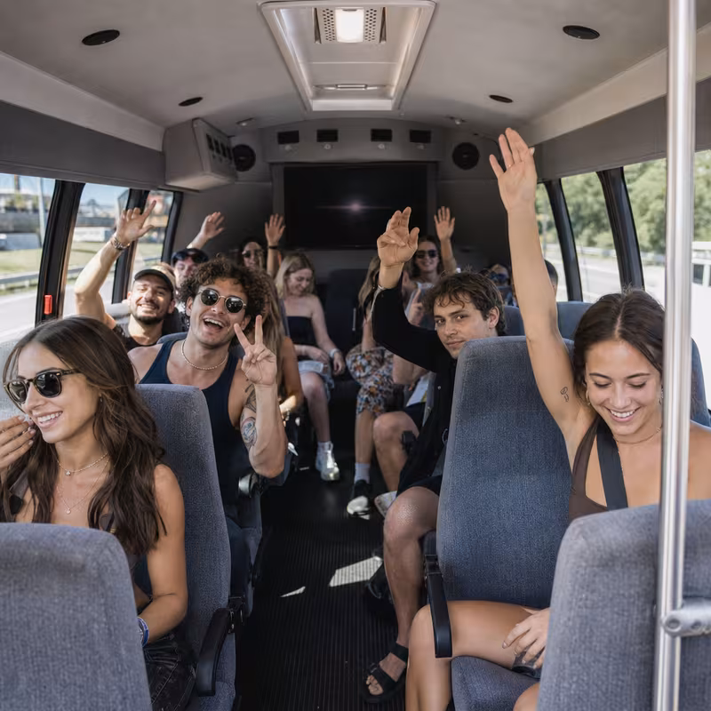 Party bus interior with wraparound leather seating and LED lighting in Lancaster