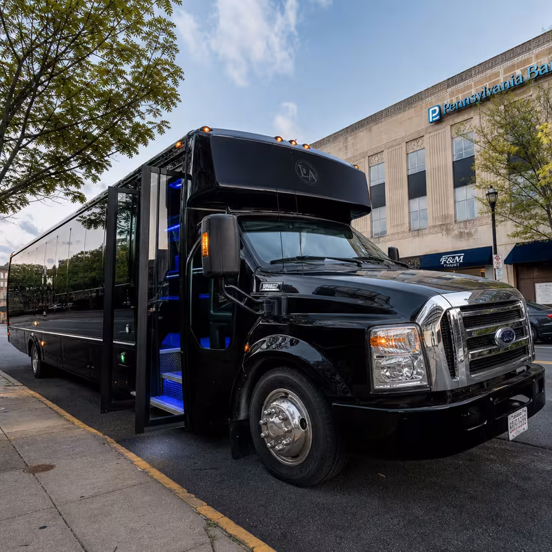 Party bus interior with wraparound leather seating and LED lighting in Lancaster