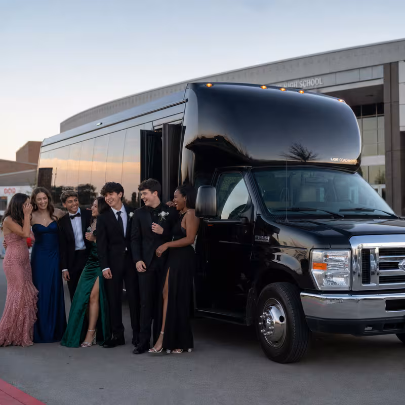 Group boarding a white charter bus for Prom & Homecoming Transportation transportation in Lancaster