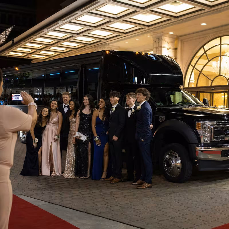 Party bus interior with wraparound leather seating and LED lighting in Lancaster