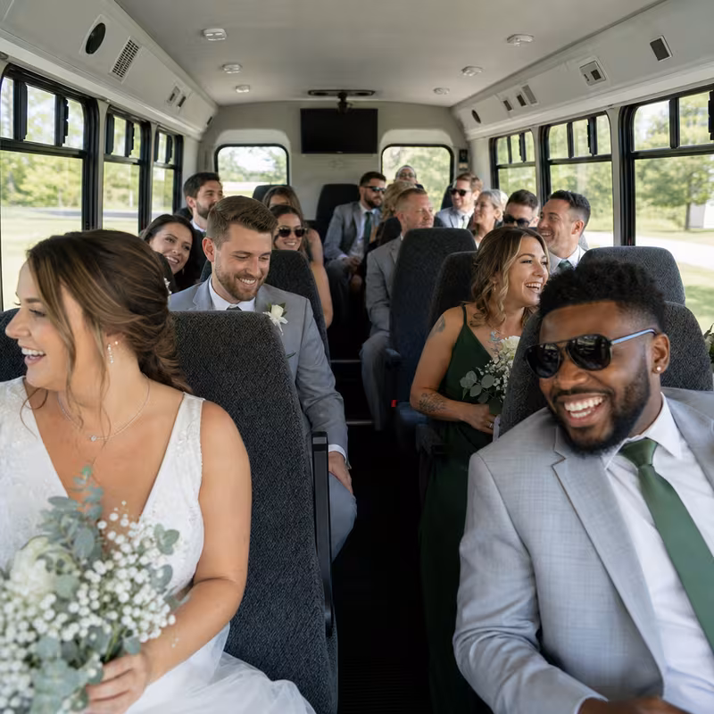 Group boarding a white charter bus for Wedding Transportation transportation in Lancaster