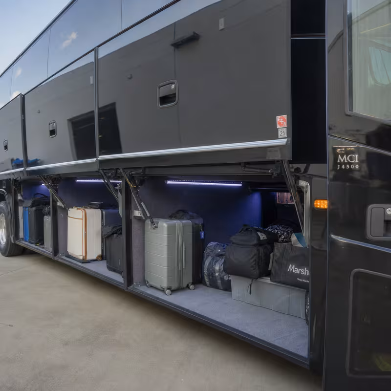 Party bus interior with wraparound leather seating and LED lighting in Lancaster