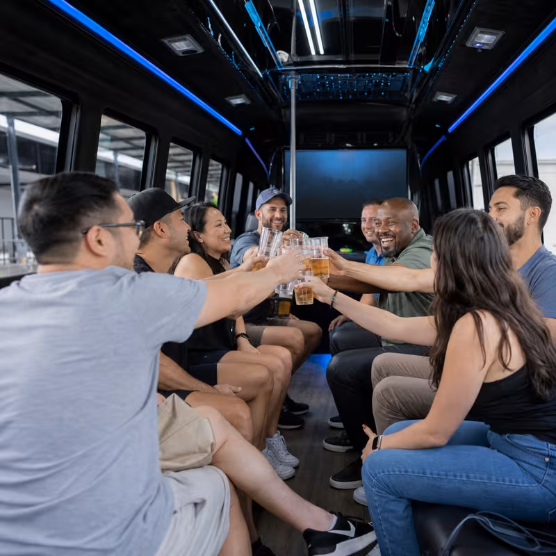 Group boarding a white charter bus for Winery & Brewery Tour Transportation transportation in Lancaster